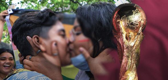 Two people kissing with the World Cup superimposed