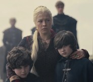 Rhaenyra holding her two young sons