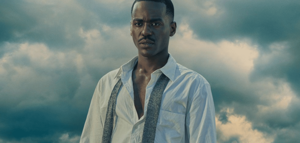 Ncuti Gatwa wearing an unbuttoned white shirt