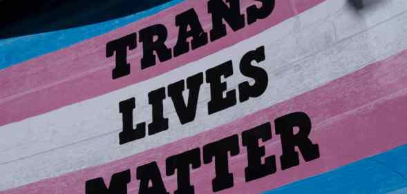 A trans flag with the words trans lives matter