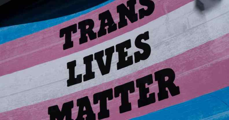 A trans flag with the words trans lives matter