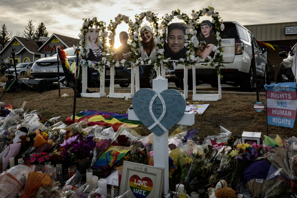 Photos of the shooting victims are displayed at a makeshift memorial outside of Club Q on November 22, 2022 in Colorado Springs, Colorado.
