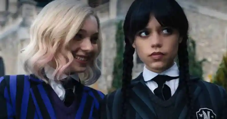 A still from new Netflix series Wednesday shows actors Emma Myers and Jenna Ortega as characters as Enid Sinclair and Wednesday Addams dressed in their school uniform costumes Enid Sinclair (L) and Wednesday (R). (Netflix)