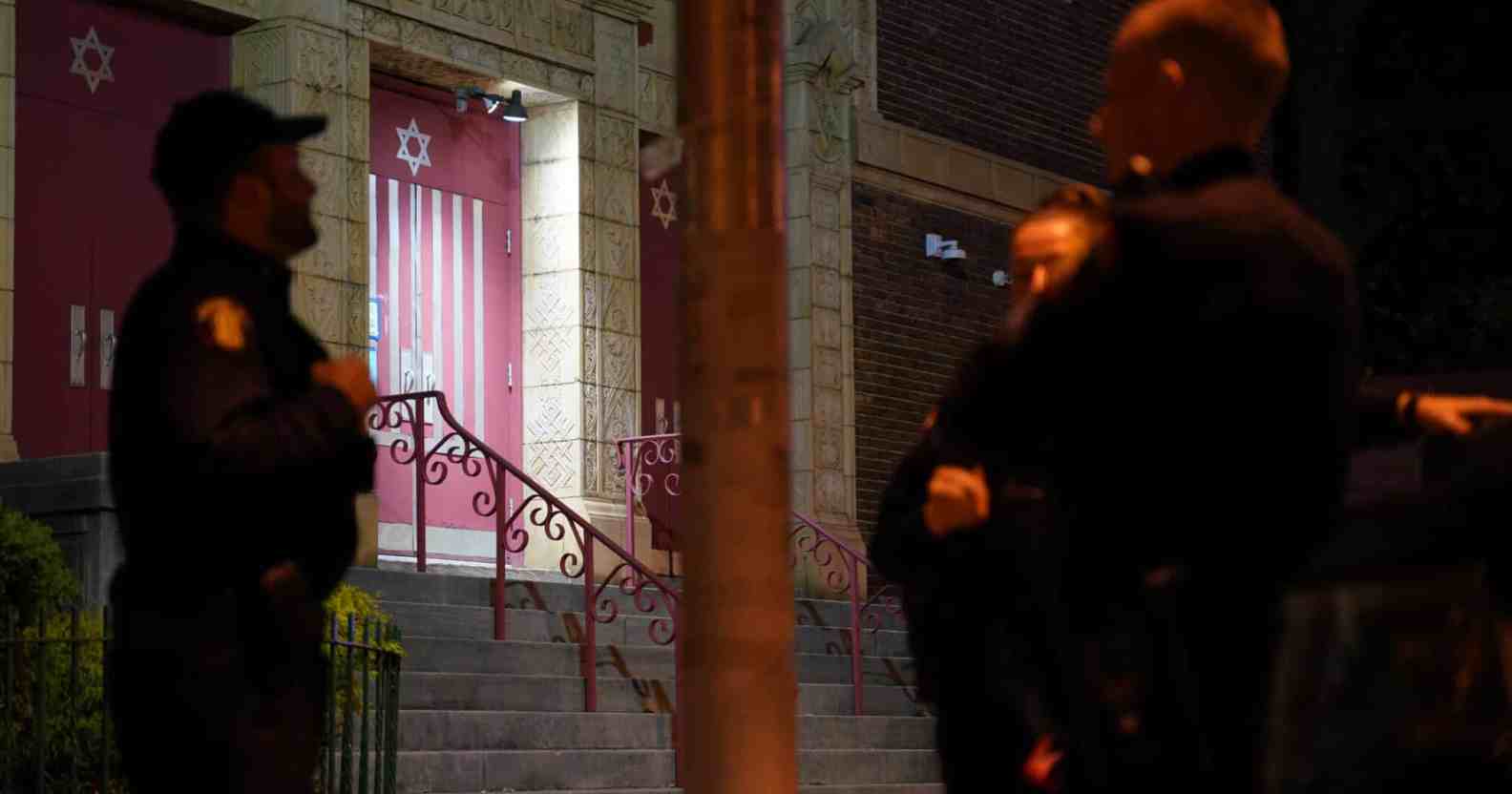 Police gather outside a synagogue in Newark, New Jersey, following the discovery of the manifesto