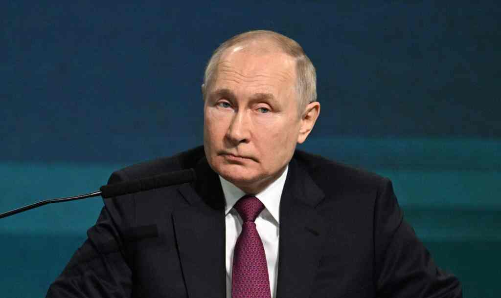 An image of Russian president Vladimir Putin during a conference.