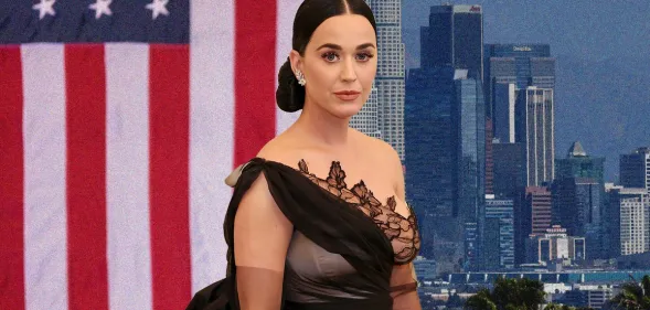 Katy Perry in a black gown in front of the Us flag
