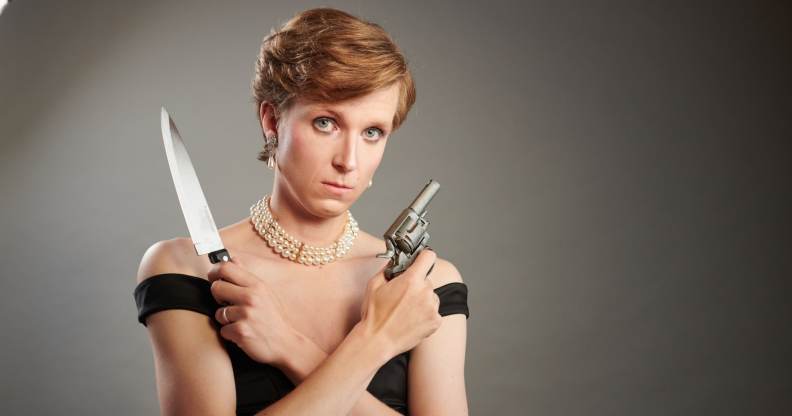 A publicity photo showing actor and writer Linus Karp as Princess Diana holding a knife and a gun from the new play Diana: The Untold and Untrue Story. (Supplied)