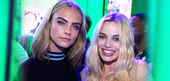 Model Cara Delevigne and actor Margot Robbie pose together