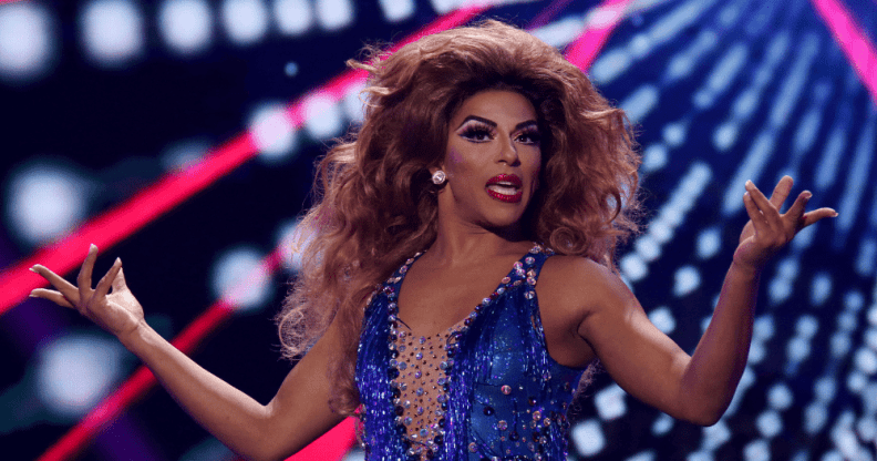 Drag queen Shangela performing in a blue leotard