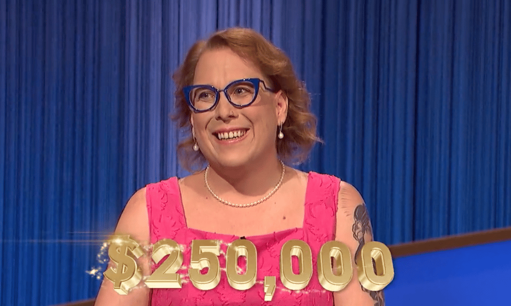 Amy Schneider wearing a pink top winning $250,000 on Jeopardy! Tournament of Champions