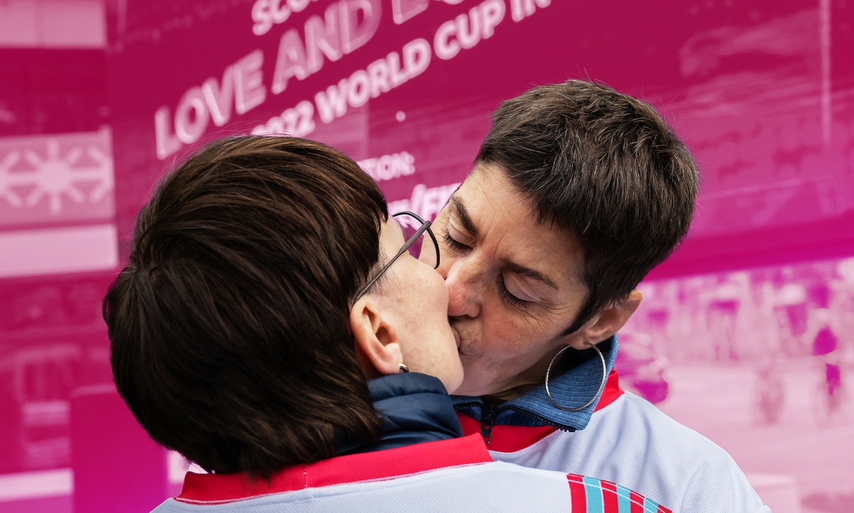 Qatar World Cup LGBTQ protesters kiss at FIFA museum