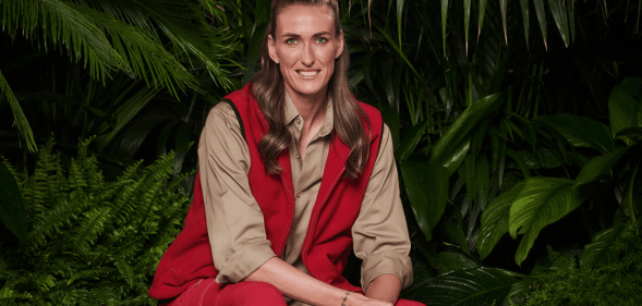 A promotional photo of England Lioness Jill Scott sitting in a jungle setting for the series I'm a Celebrity, Get Me Outta Here