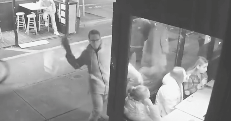 CCTV footage of man throwing a brick at window