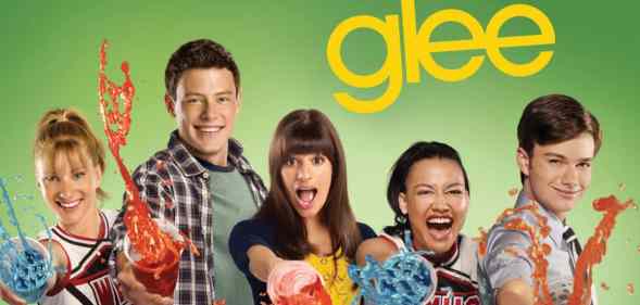 A promotional still of TV series Glee featuring all of the main cast superimposed against a green background with the Glee logo above them