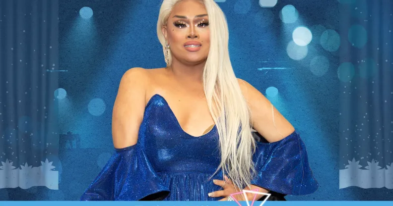 An image for Trans Awareness Week shows drag queen Jiggly Caliente wearing a blue dress standing in front of a blue background with spotlights