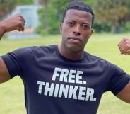 A photo shows gay Iraq war veteranRob Smith standing in a field wearing a t-shrit that reads "free thinker"