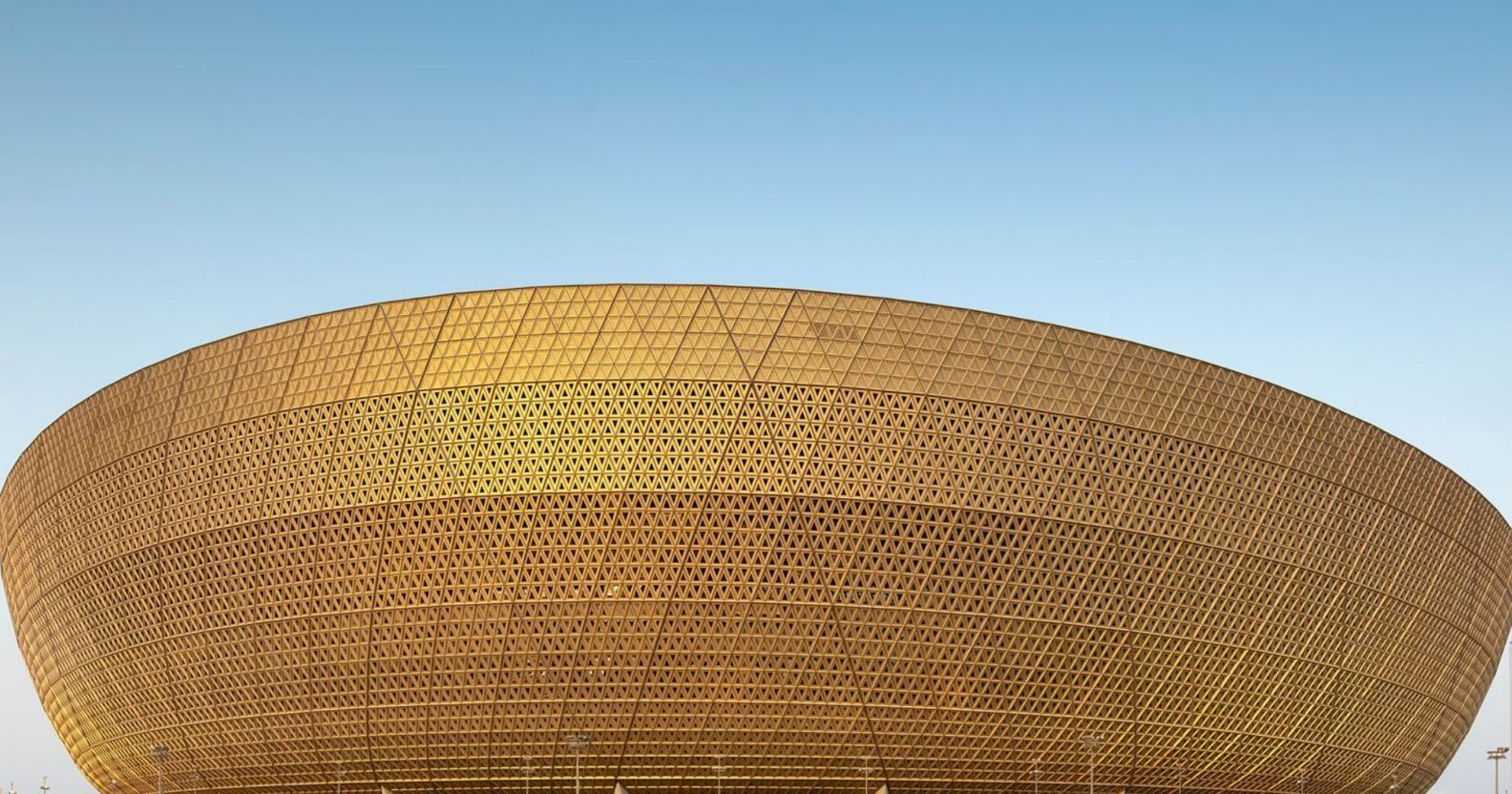 A picture of the golden-brown outer rim of the Lusail stadium in Doha, Qatar