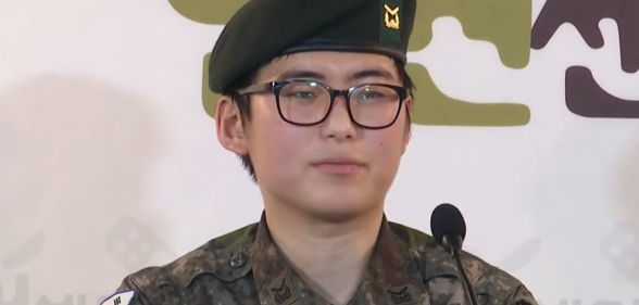 Byun Hee-soo sits wearing a traditional South Korean military uniform while at a press conference.