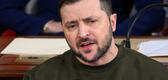 Volodymyr Zelenskyy in an army green jumper, speaks to the US parliament.
