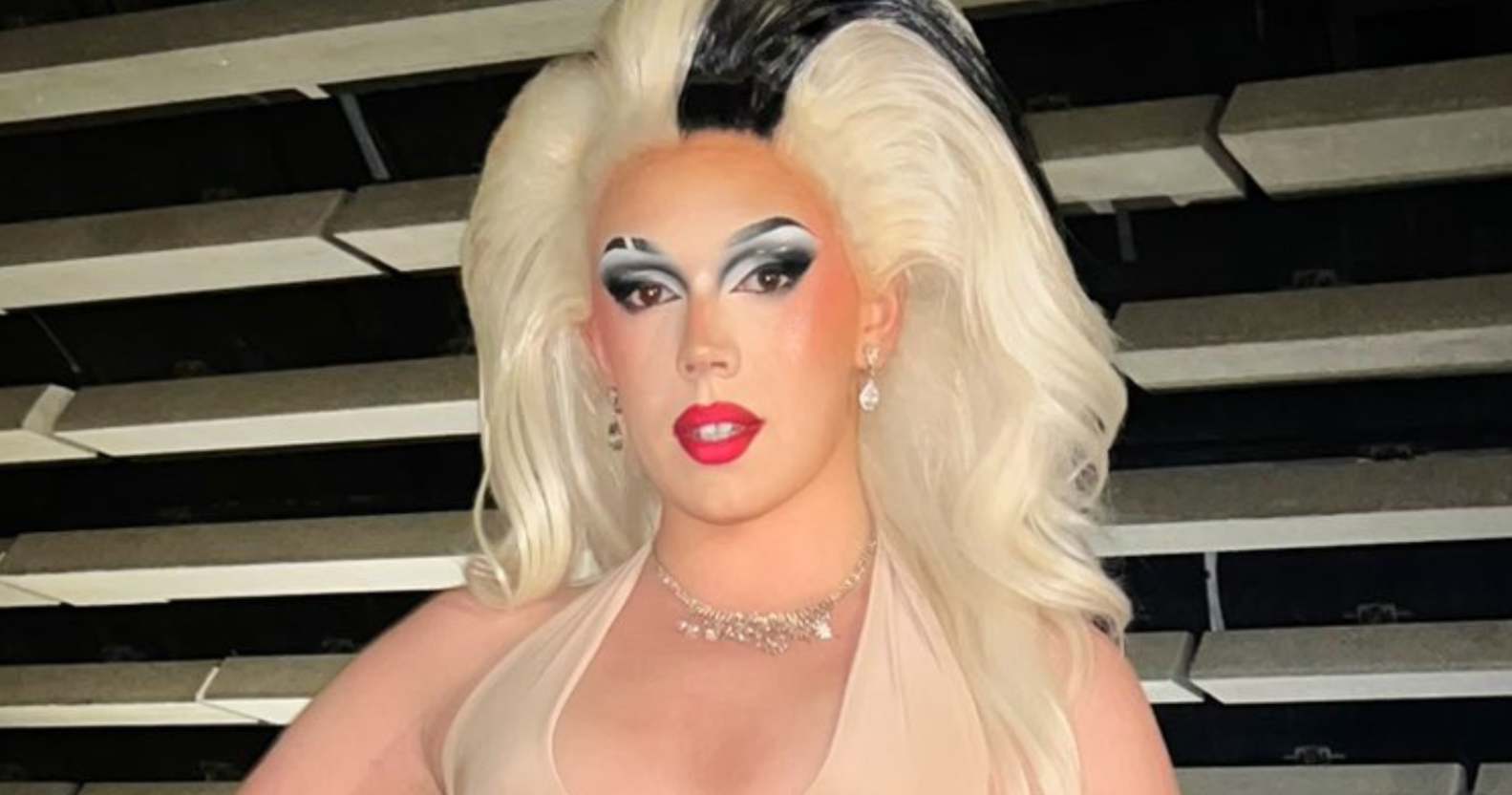 Miss Peaches dressed in a blonde wig and makeup for a Drag event.