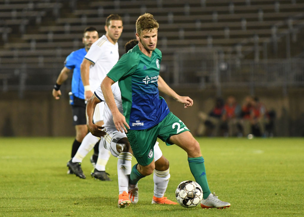 Collin Martin controls the ball during a USL match between North Carolina FC and the Hartford Athletics on June 1, 2019. 