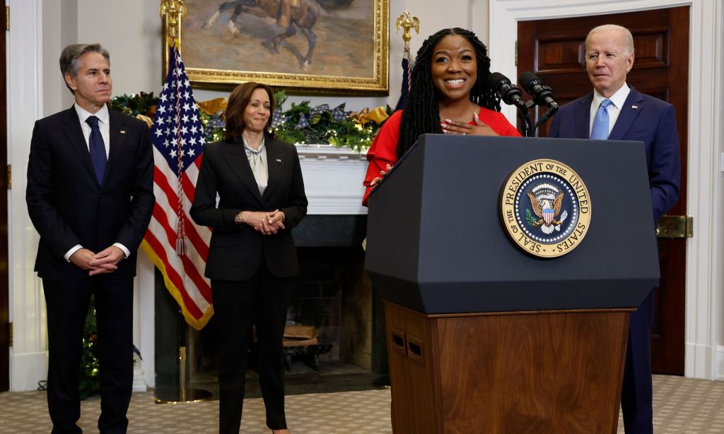 Brittney Griner's wife Cherelle stands at a podium as she speaks at the White House with president Joe Biden standing beside her