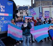 A group of people holding up the trans flags and signs in support of the trans community call on MSPs to pass the Gender Recognition Reform (Scotland) bill