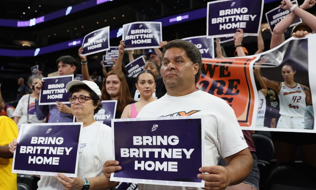 People hold up signs reading 'Bring Brittney Home' advocating for the release of LGBTQ+ basketball star Brittney Griner from Russia