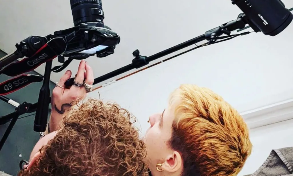 Photographer Beliza Buzollo and Jamie Boy King on set of an all-trans nude calendar photoshoot