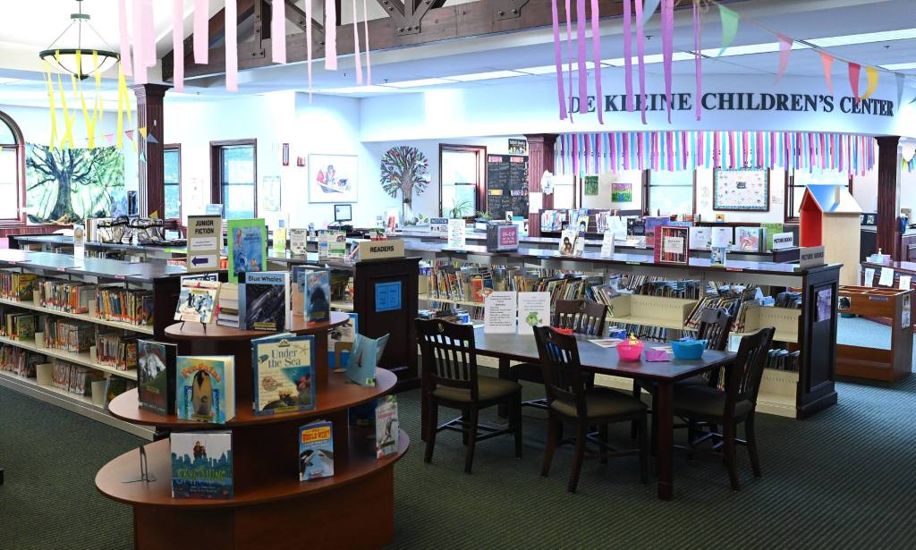 Books are displayed at the Patmos Library in Jamestown, Michigan. The library has been increasingly targeted by conservatives over its inclusion of LGBTQ+ books