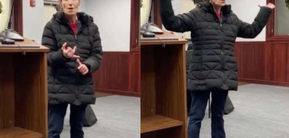 A librarian gestures with her hands as speaks before a board meeting about threats and harassment she's received because conservatives are angry over the library's LGBTQ+ books collections
