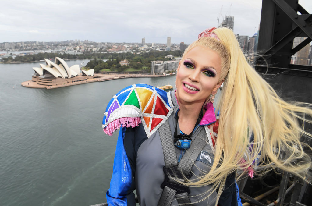 Courtney Act overlooking the Sydney Opera House from the Sydney Harbour Bridge