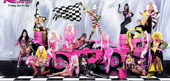 A promotional picture of Drag Race Season 15 showing all the new drag queens posing around a pink sports car