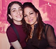 A graphic composite of Emily Estefan (L) with mother Gloria Estefan superimposed over an old family photo of the pair that has a pink tint over it. (Getty)