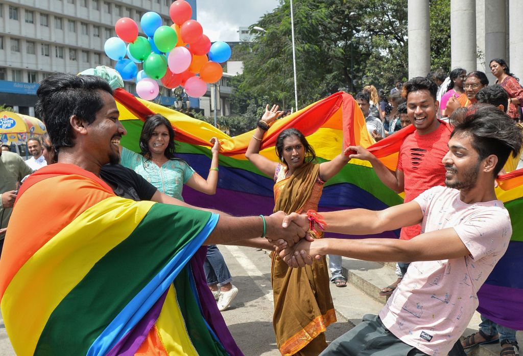 Indian members and supporters of the LGBT community celebrate the Supreme Court decision to strike down a colonial-era ban on gay sex, in Bangalore on September 6, 2018.