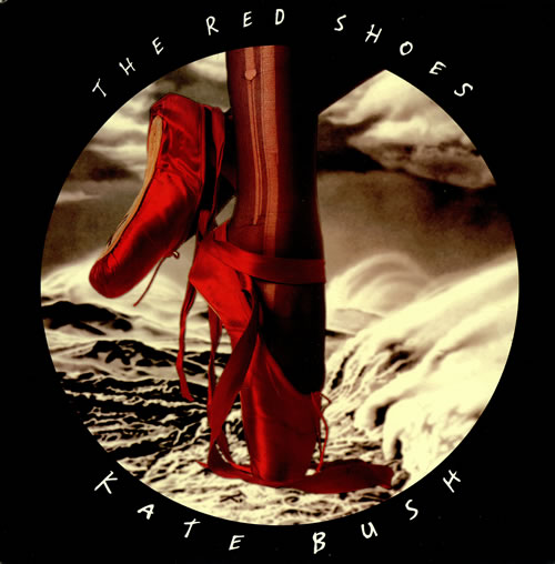 The album artwork for The Red Shoes by Kate Bush. A woman's red shoes are shown on pointed toe in ballet slippers with a black background.