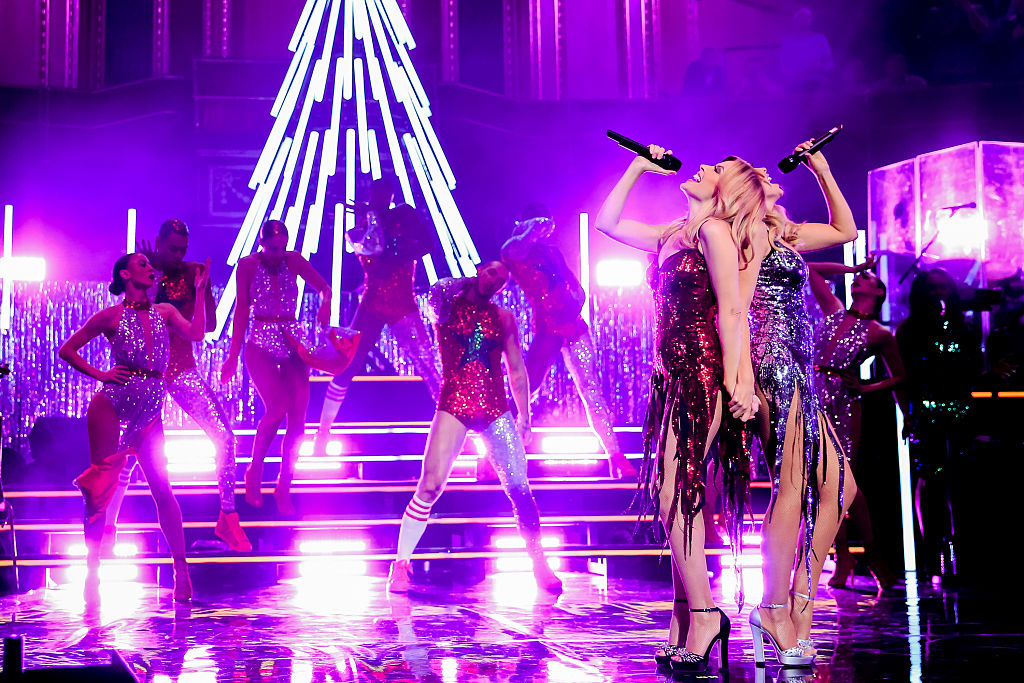 Kylie Minogue is joined by Dannii Minogue on stage during her Christmas show at the Royal Albert Hall.
