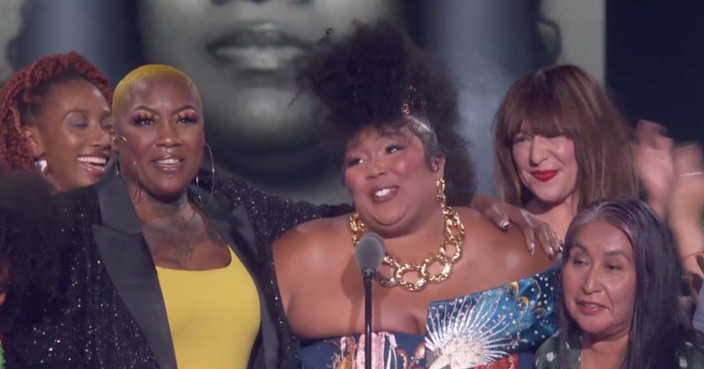 Lizzo surrounded by activists, (NBC)