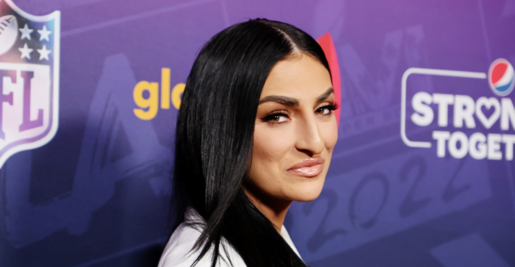 Sonya DeVille wearing a white suit at the A Night Of Pride With GLAAD And NFL.