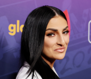 Sonya DeVille wearing a white suit at the A Night Of Pride With GLAAD And NFL.