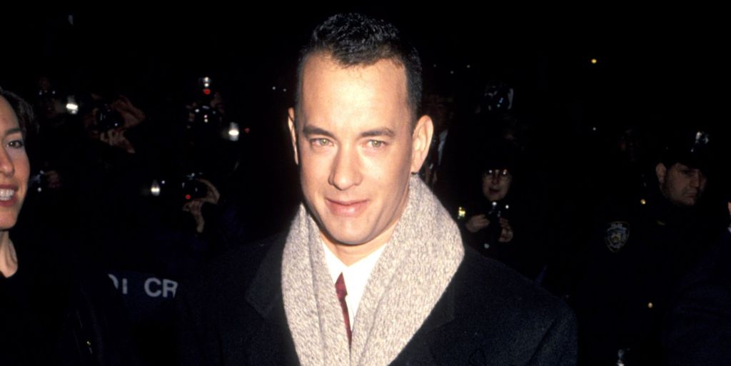 Tom Hanks in a black jacket and scarf at the premiere of Philadelphia