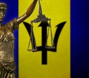 Lady Justice in front of the Barbados flag