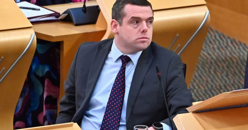 Douglas Ross sitting in parliament
