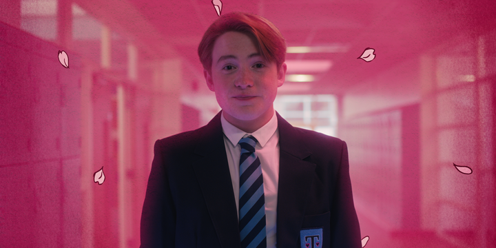 A still from Netflix's Heartstopper which shows Kit Connor as Nick Nelson wearing his school uniform