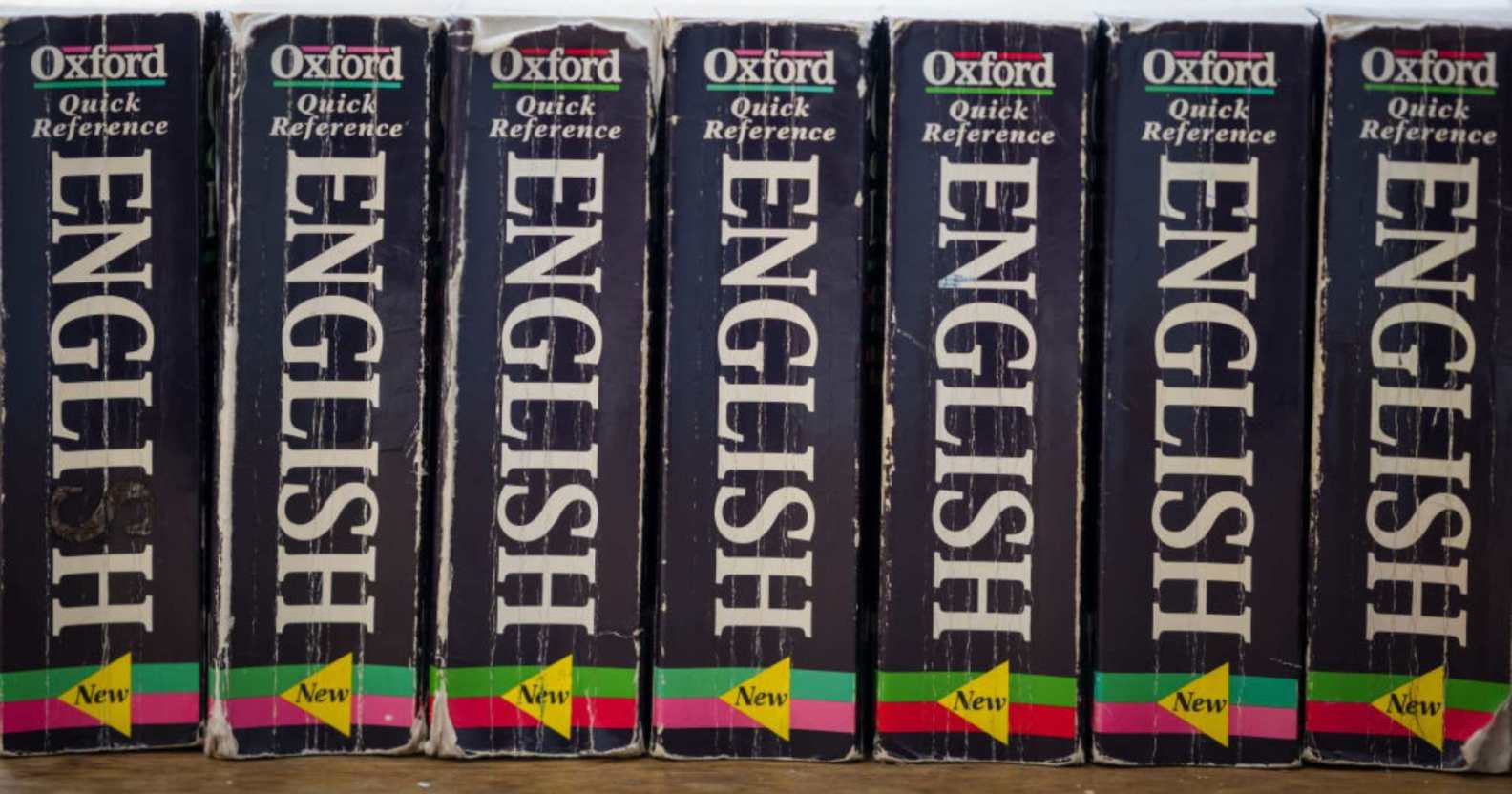 Photo showing copies of the Oxford English Dictionary in a row