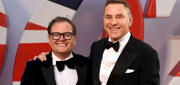 Alan Carr and David Walliams at the premiere of No Time To Die, wearing black suits and bowties.