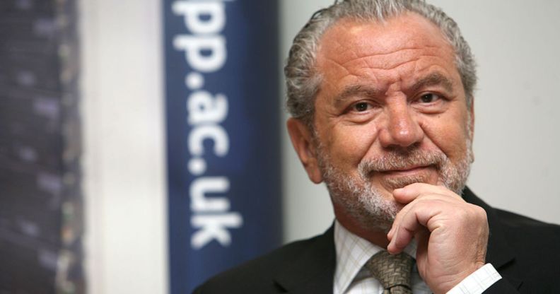Alan Sugar in a promotional image. He is seen wearing a dark suit and tie.