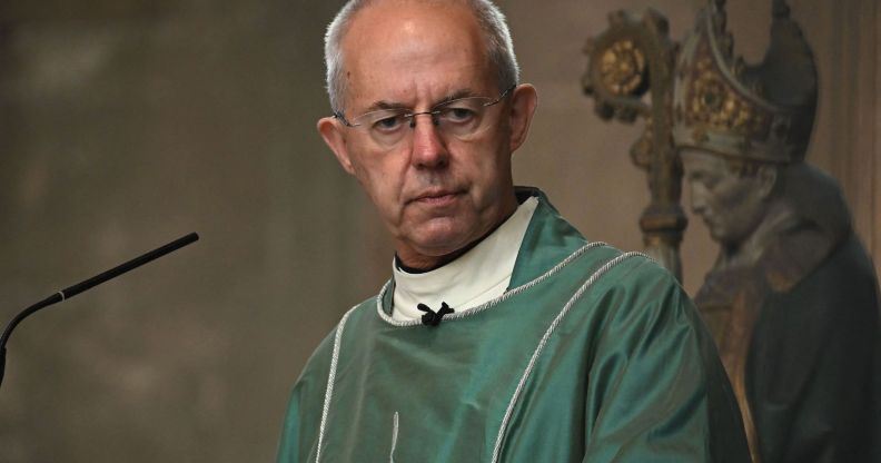 Archbishop of Canterbury, dressed in green robes, presides over a congregation.