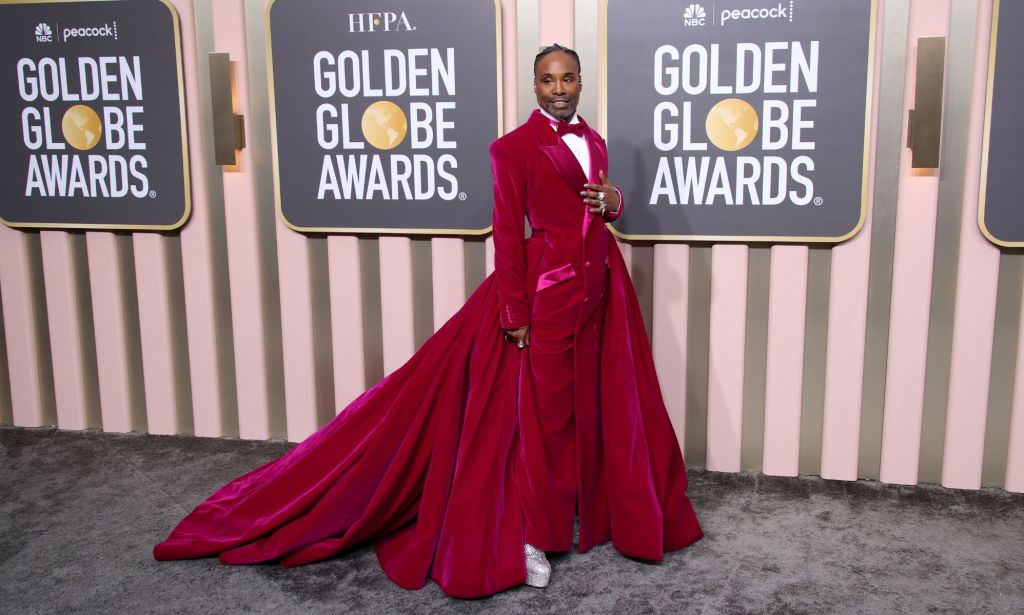 Billy Porter in a pink tuxedo gown on the Golden Globes red carpet.