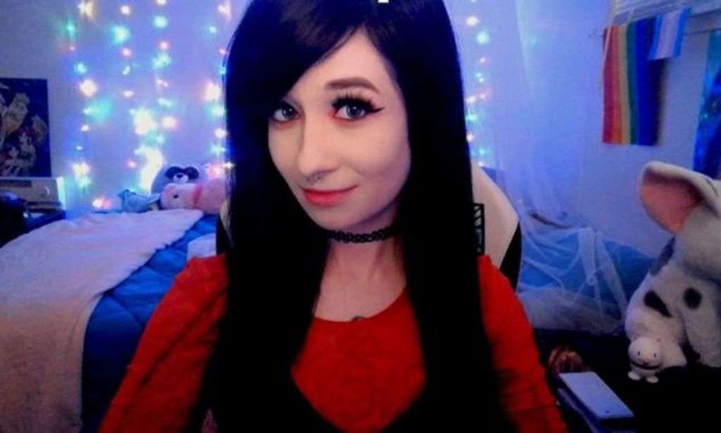 Twitch streamer Boba in her room, wearing a red top.